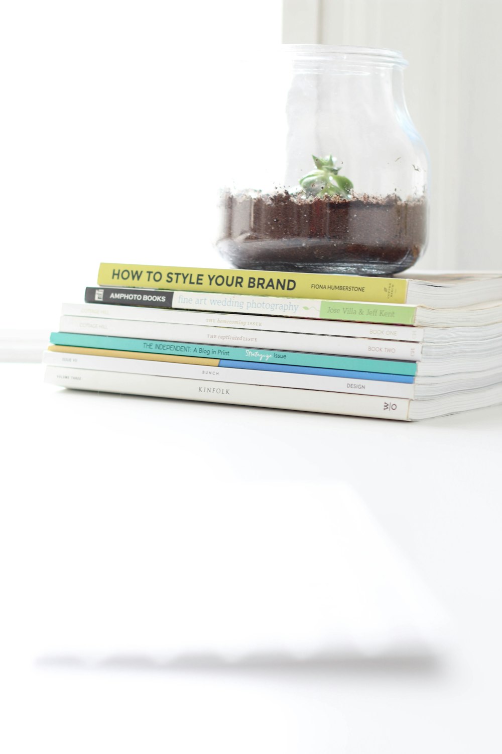 stack of books on white table