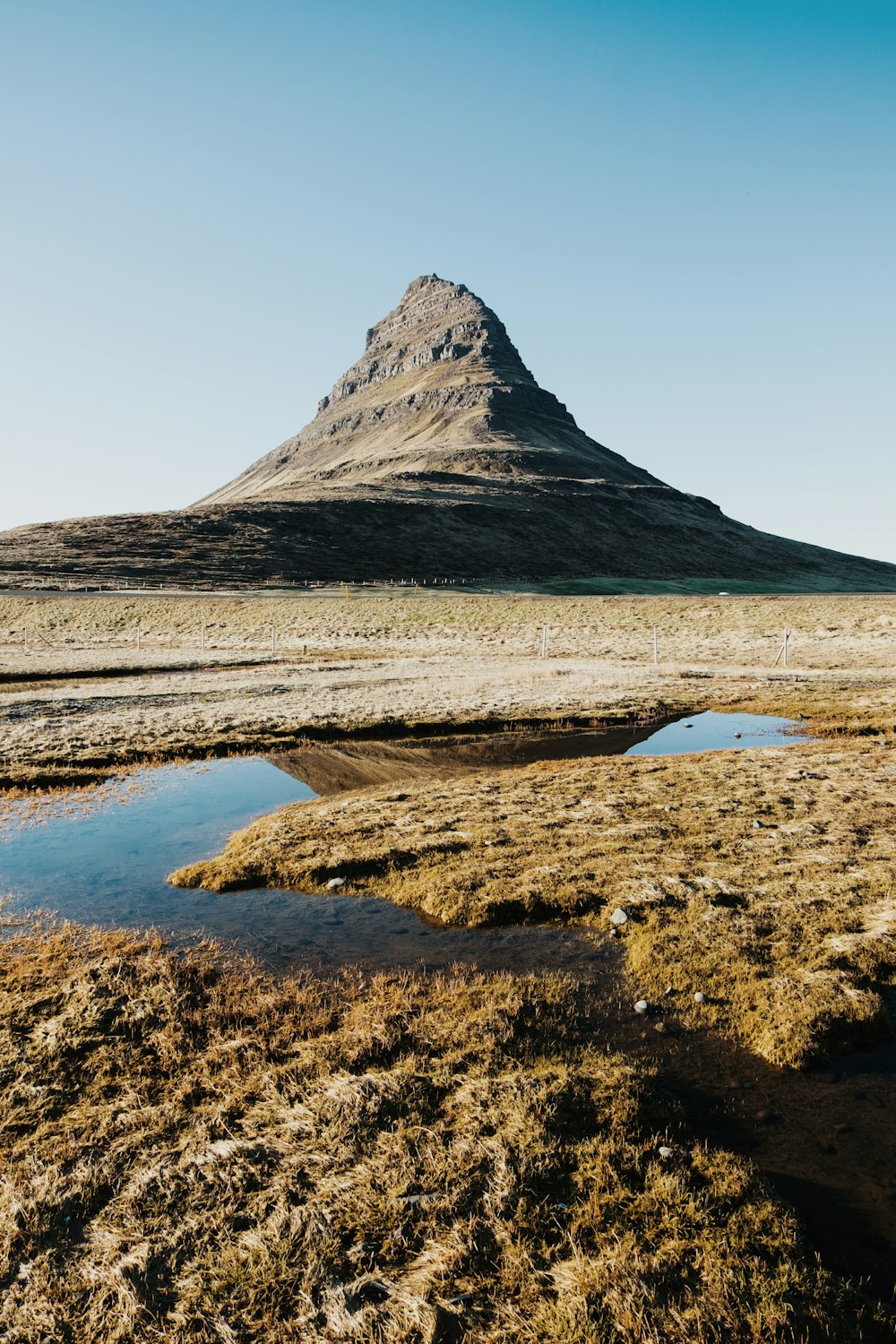 gray land formation under blue sky