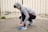 Man tying his shoenixoe sneakers before heading out for a morning jog in the park.