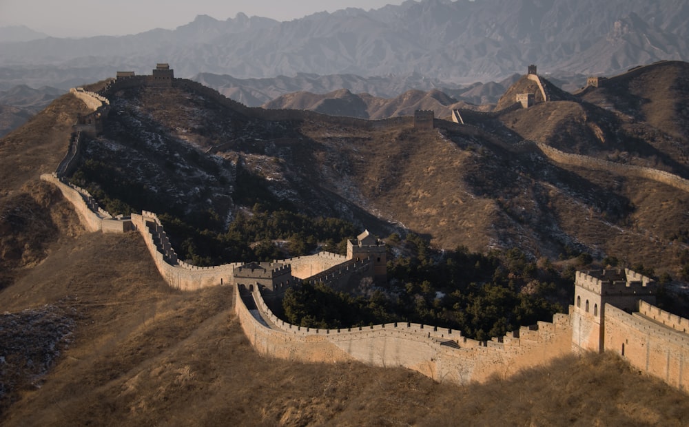 great wall of china on mountains with green trees