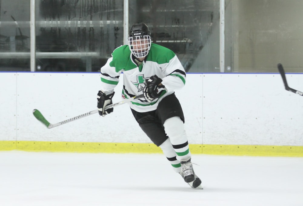 ice hockey player holding stick