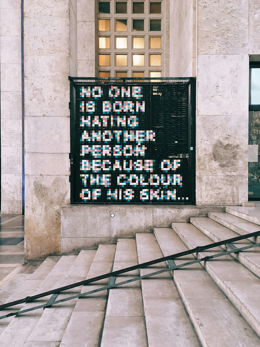no one is born hating another person because of the colour of his skin signage