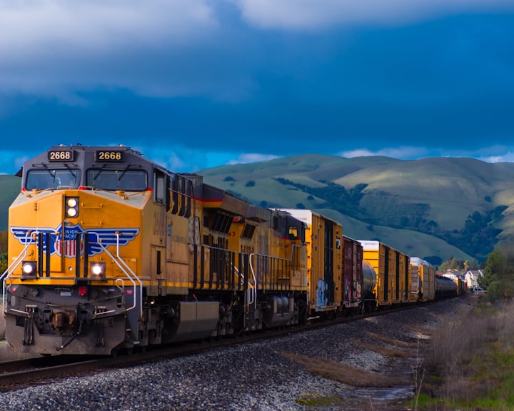 A Union Pacific freight train pulling cargo across the countryside