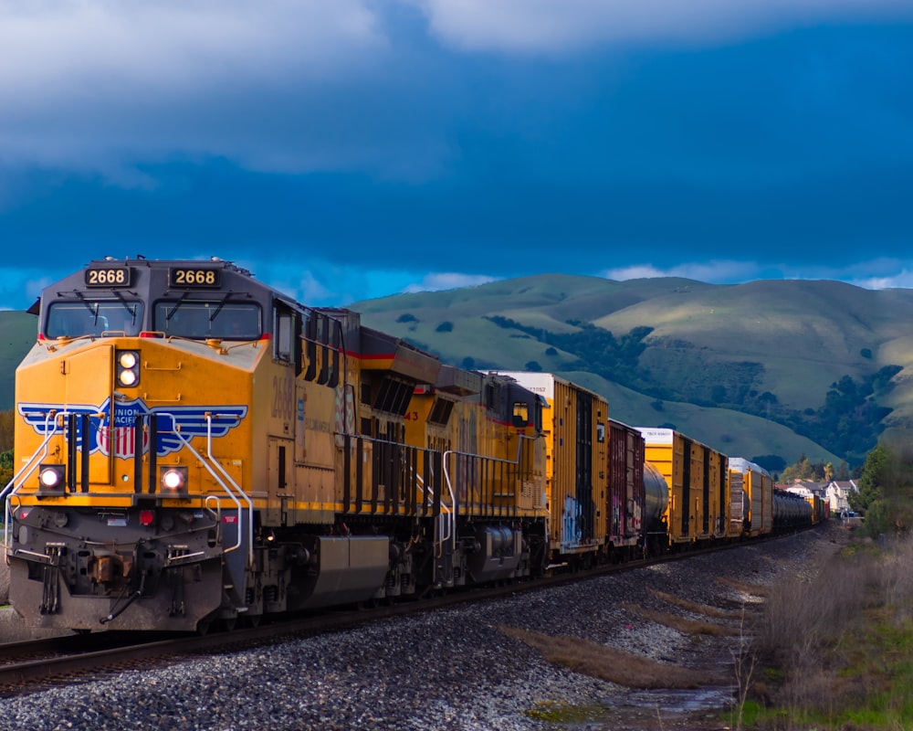 yellow and black train near mountain