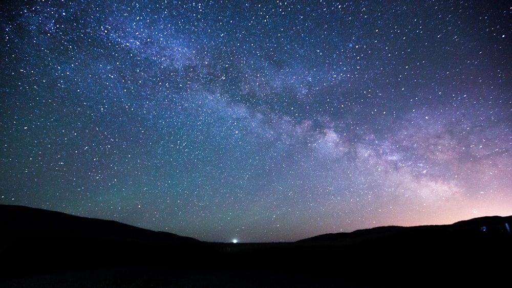 starry night over silhouette of hills