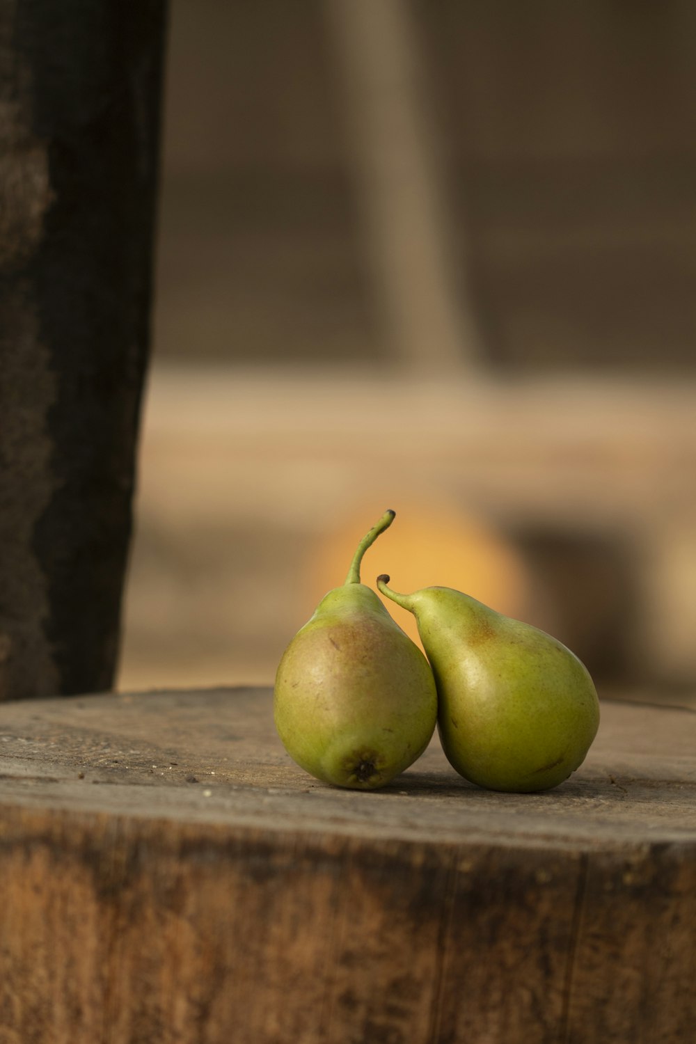 two pears on wood
