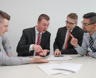 Professional lawyers discussing vehicle financing contracts in a modern office.