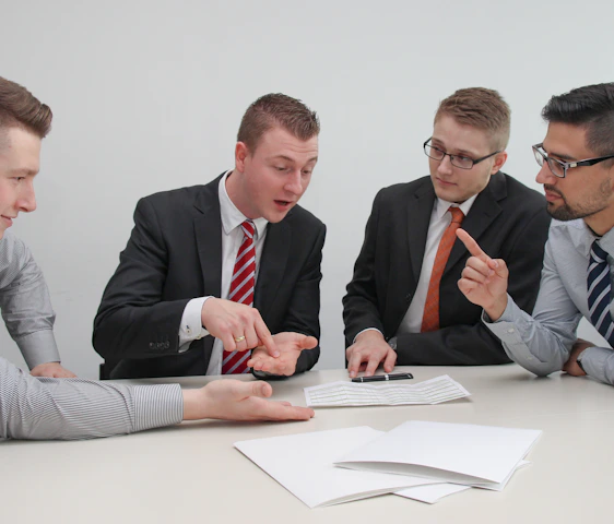 Professional lawyers discussing vehicle financing contracts in a modern office.