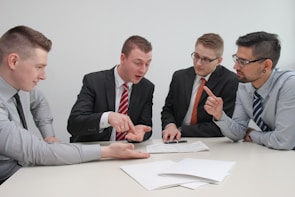 A team of financial advisors discussing strategies in a meeting.