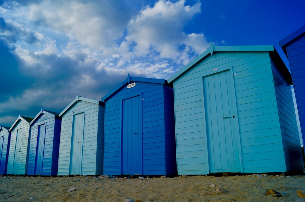 blue and white sheds under blue sky