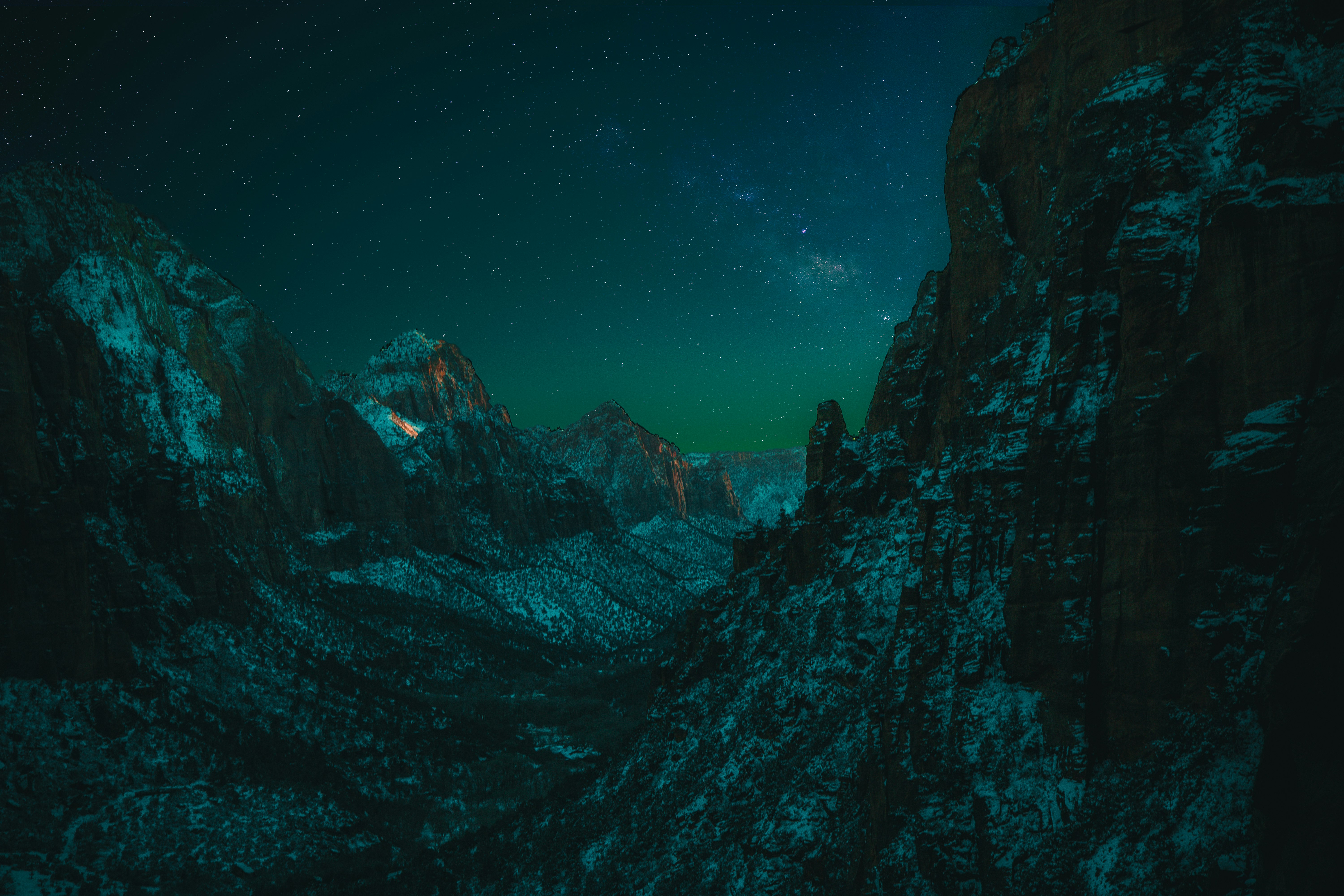 black mountain under clear night sky