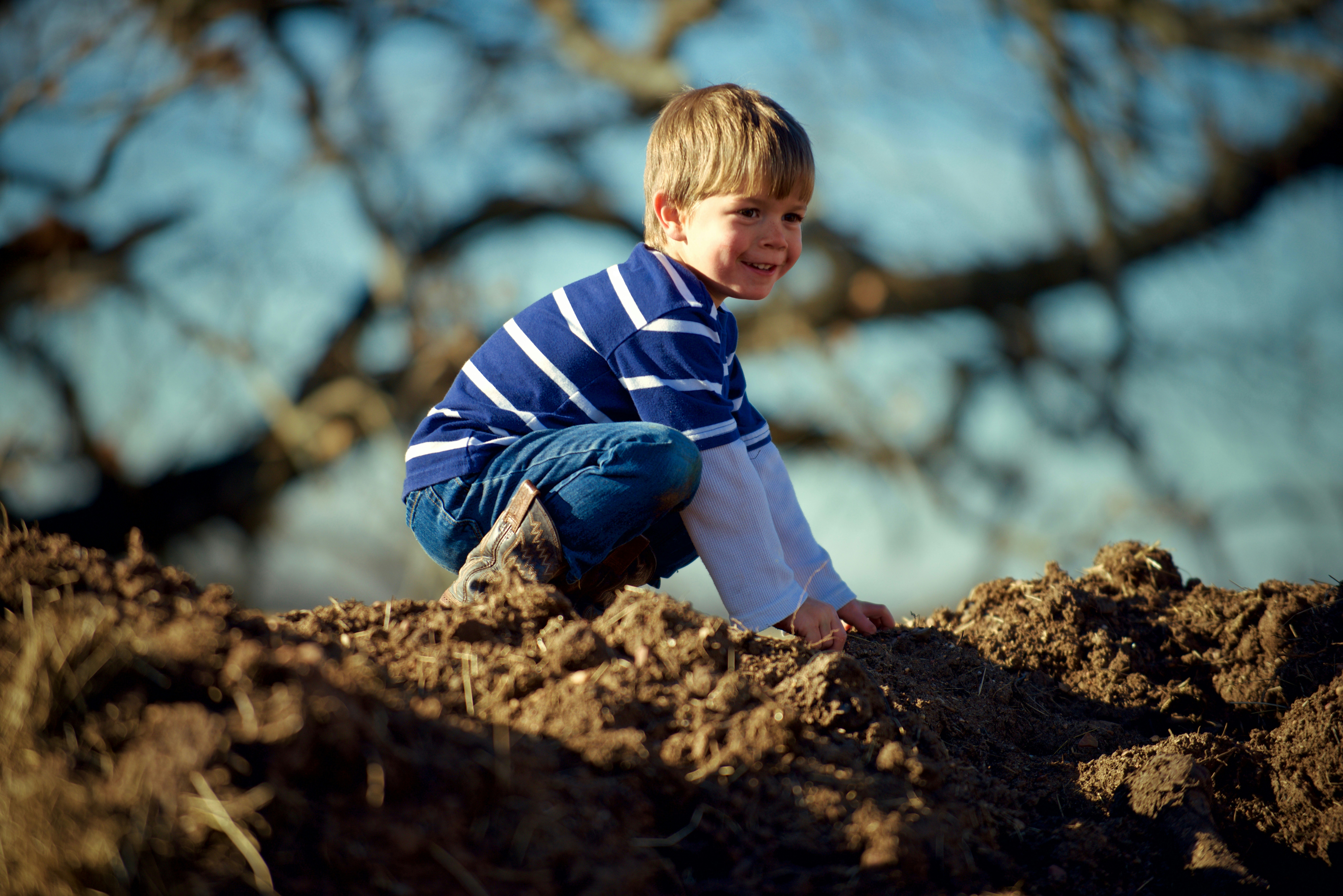 toddler playing rocks