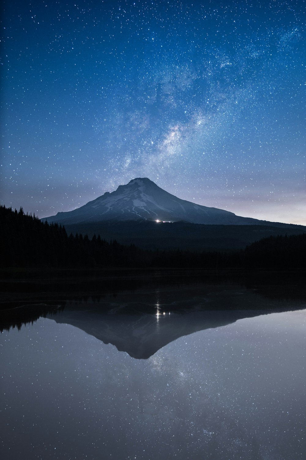 body of water with mountain at distance