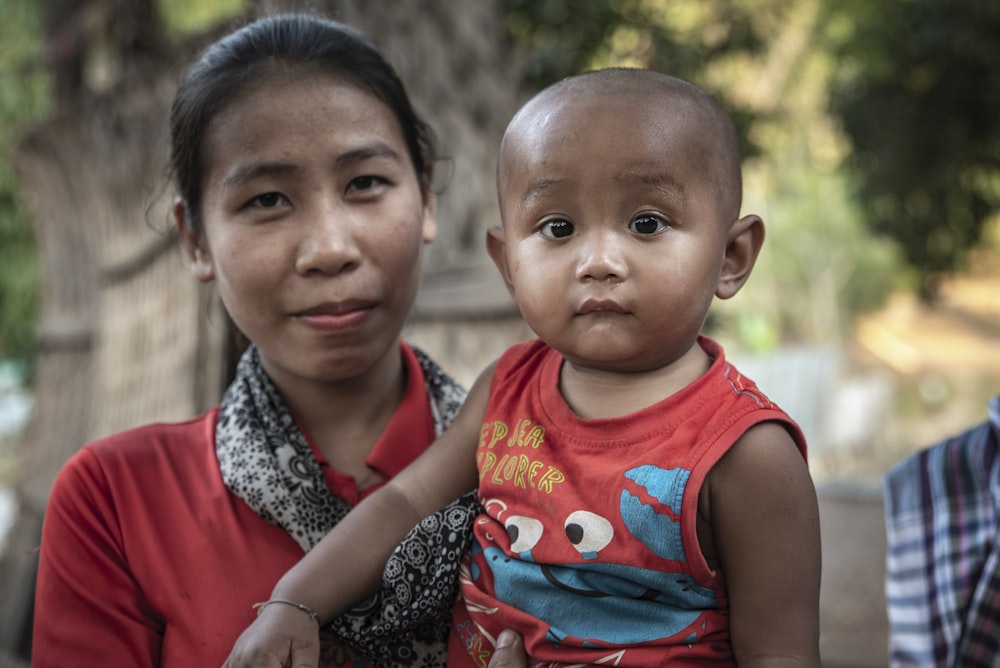 woman holding toddler