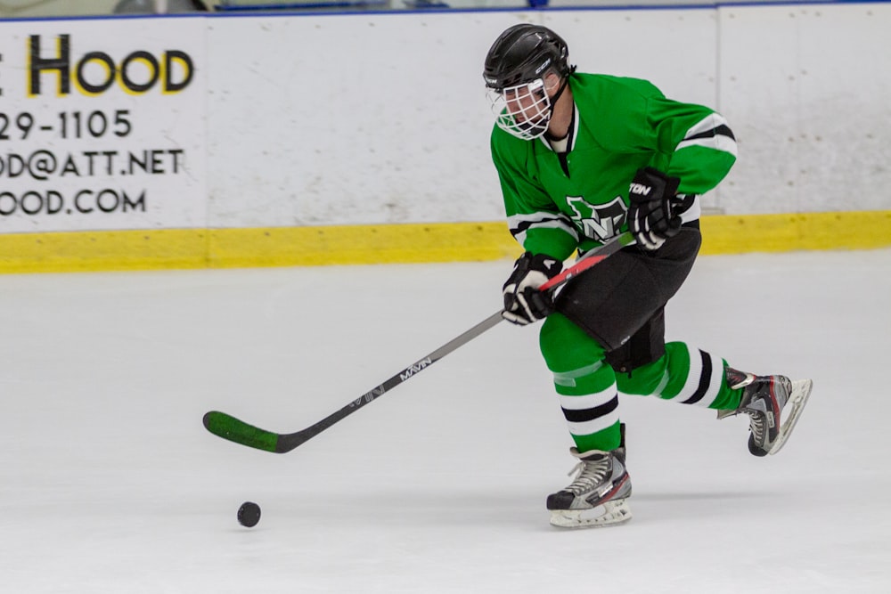 man in hockey gear playing hockey