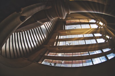 low angle photography of spiral stairs wicked teams background