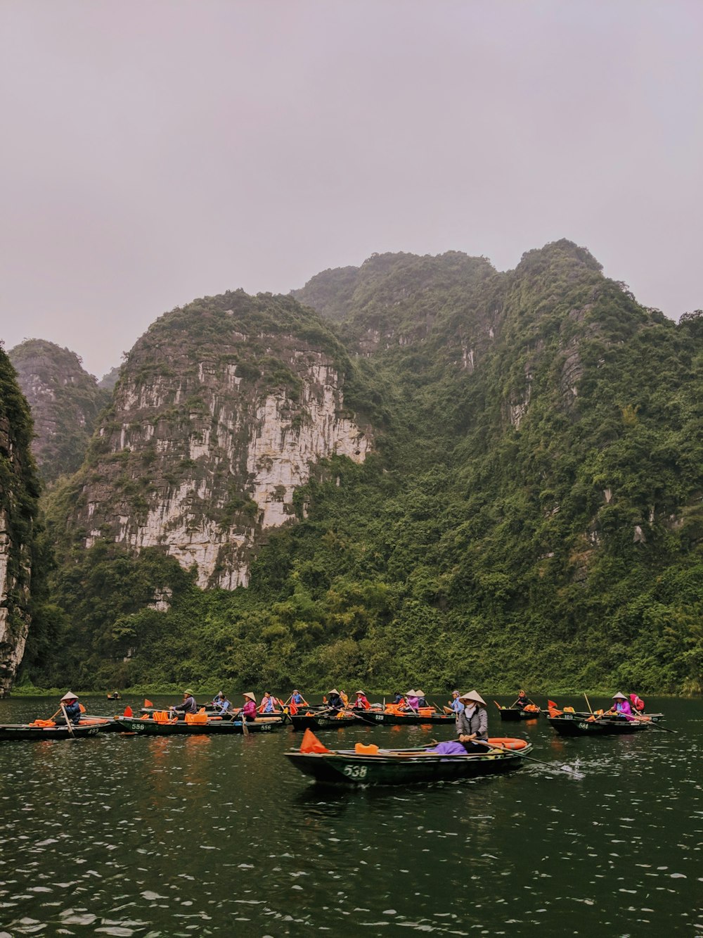 people on canoe during daytime