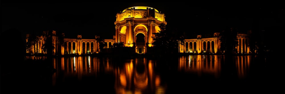 panoramic photography of concrete building at nighttime