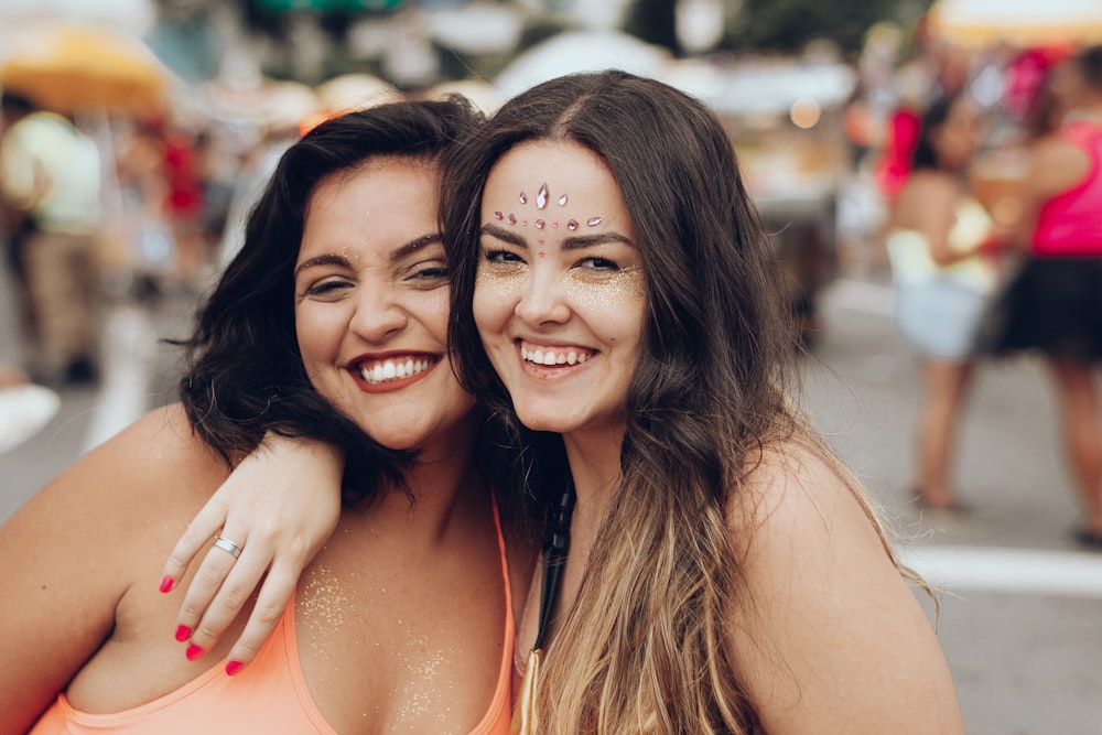 selective focus photography of two women on street