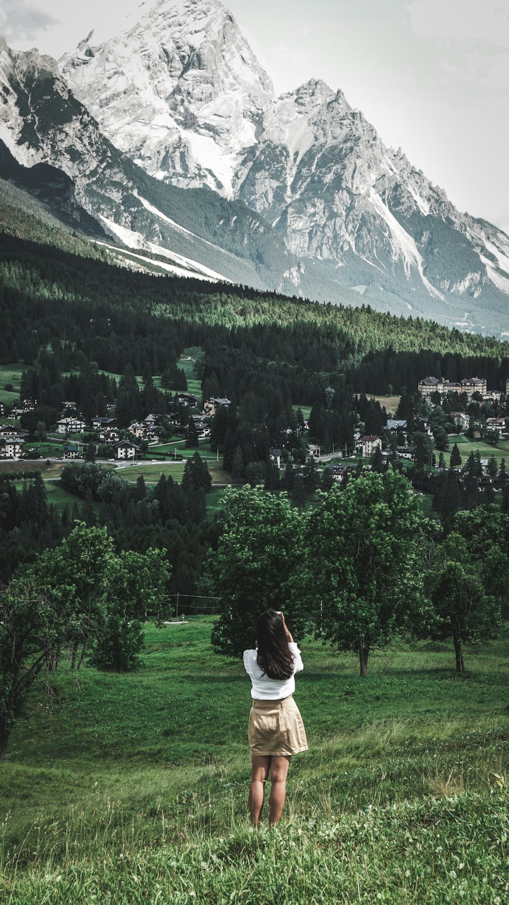 woman standing on green grass