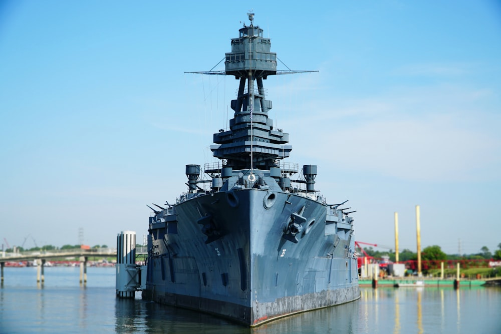 gray battleship on body of water during daytime