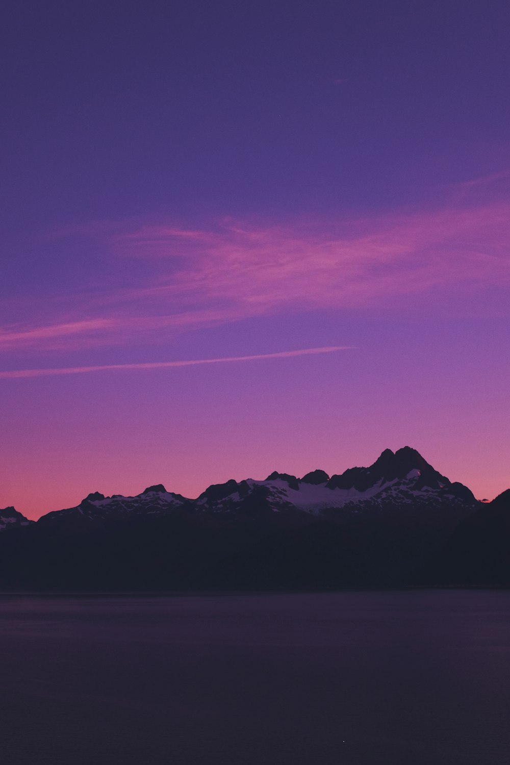 silhouette of mountain under clear sky