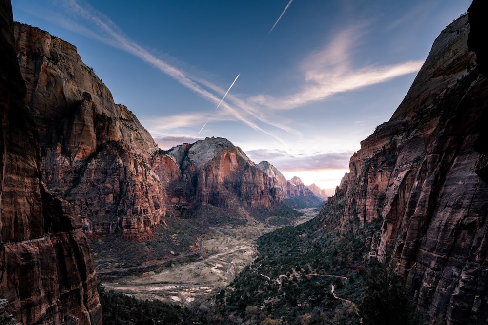 a scenic view of a valley with a river running through it