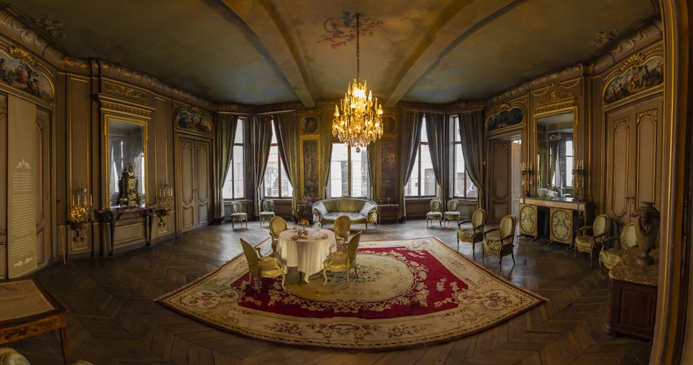 room with area rug and chandelier