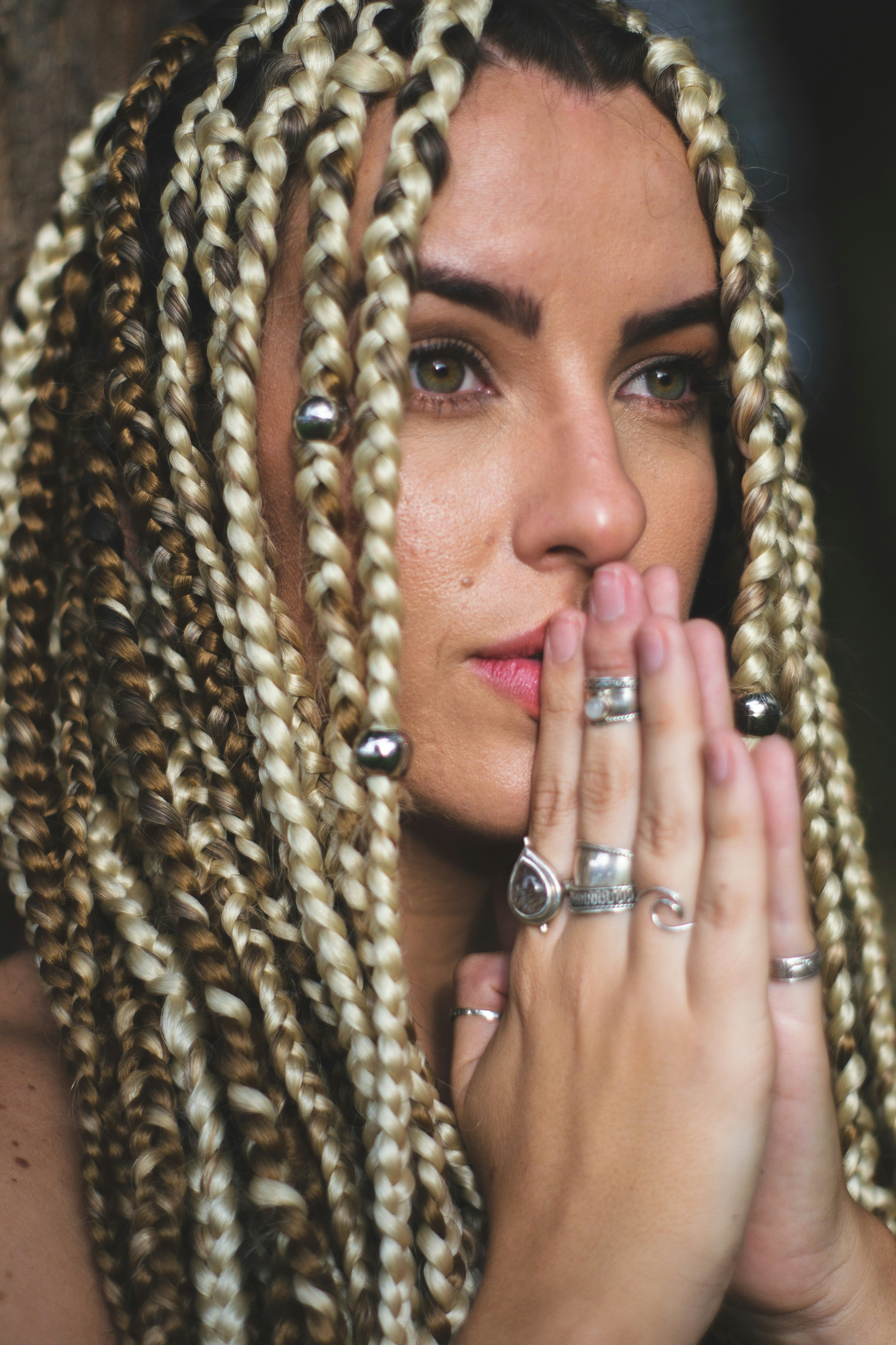 woman wearing silver-colored ring lot