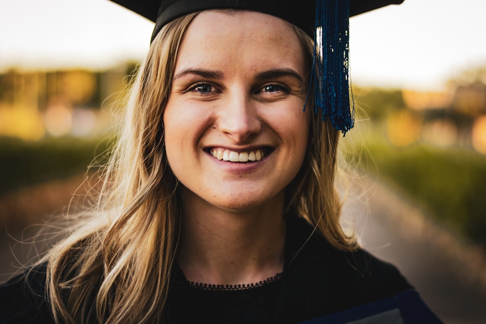 woman wearing black toga and mortar board