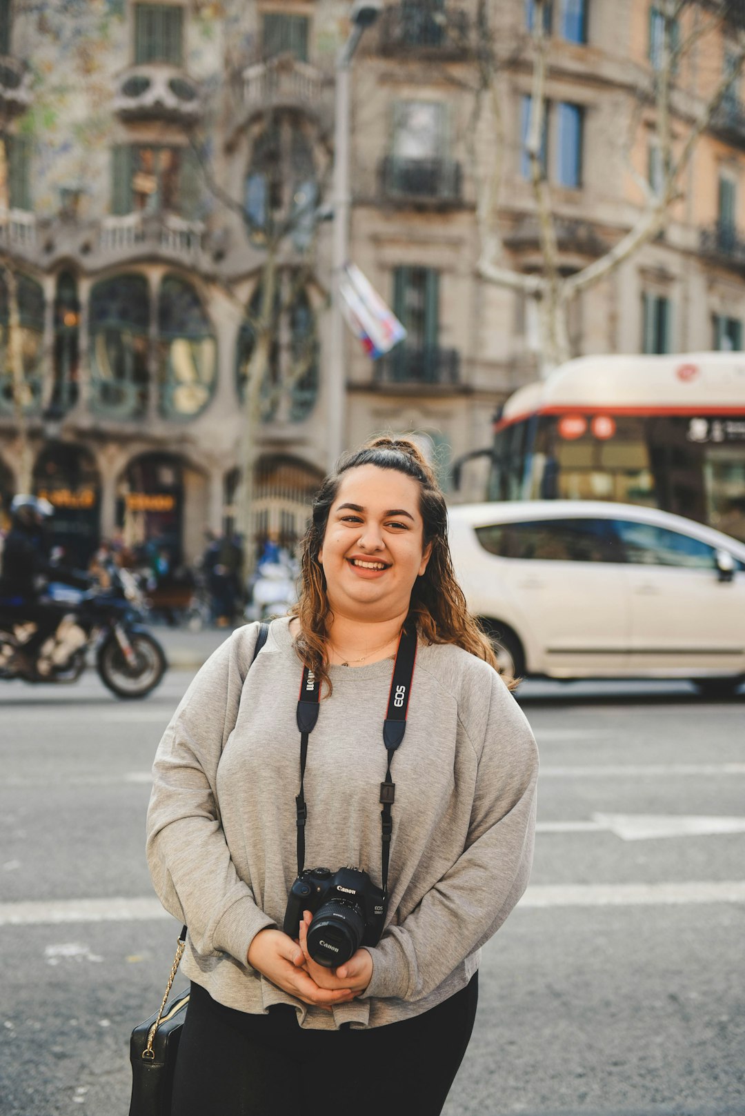 smiling woman wearing gray sweater