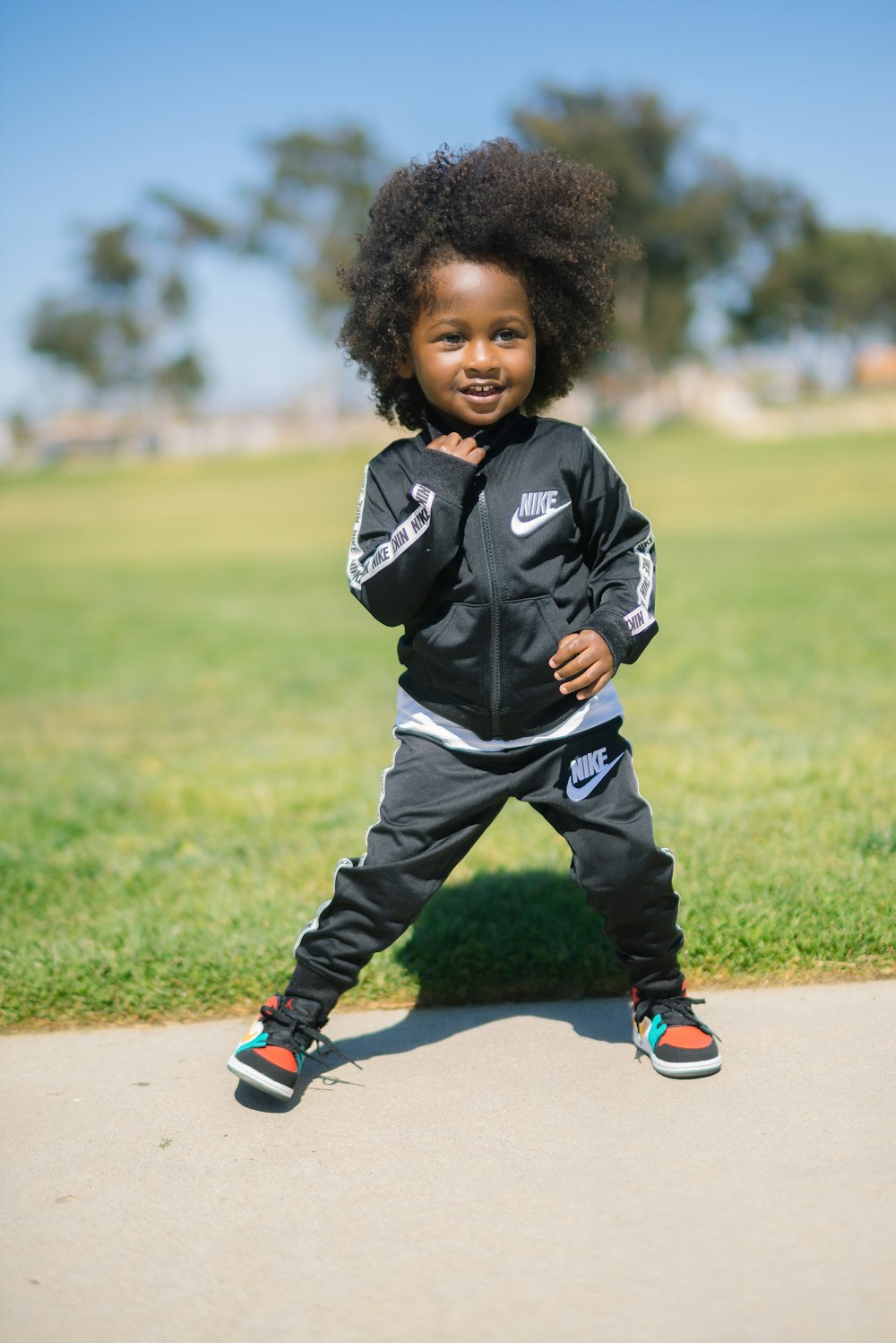 boy wearing black Nike track suit