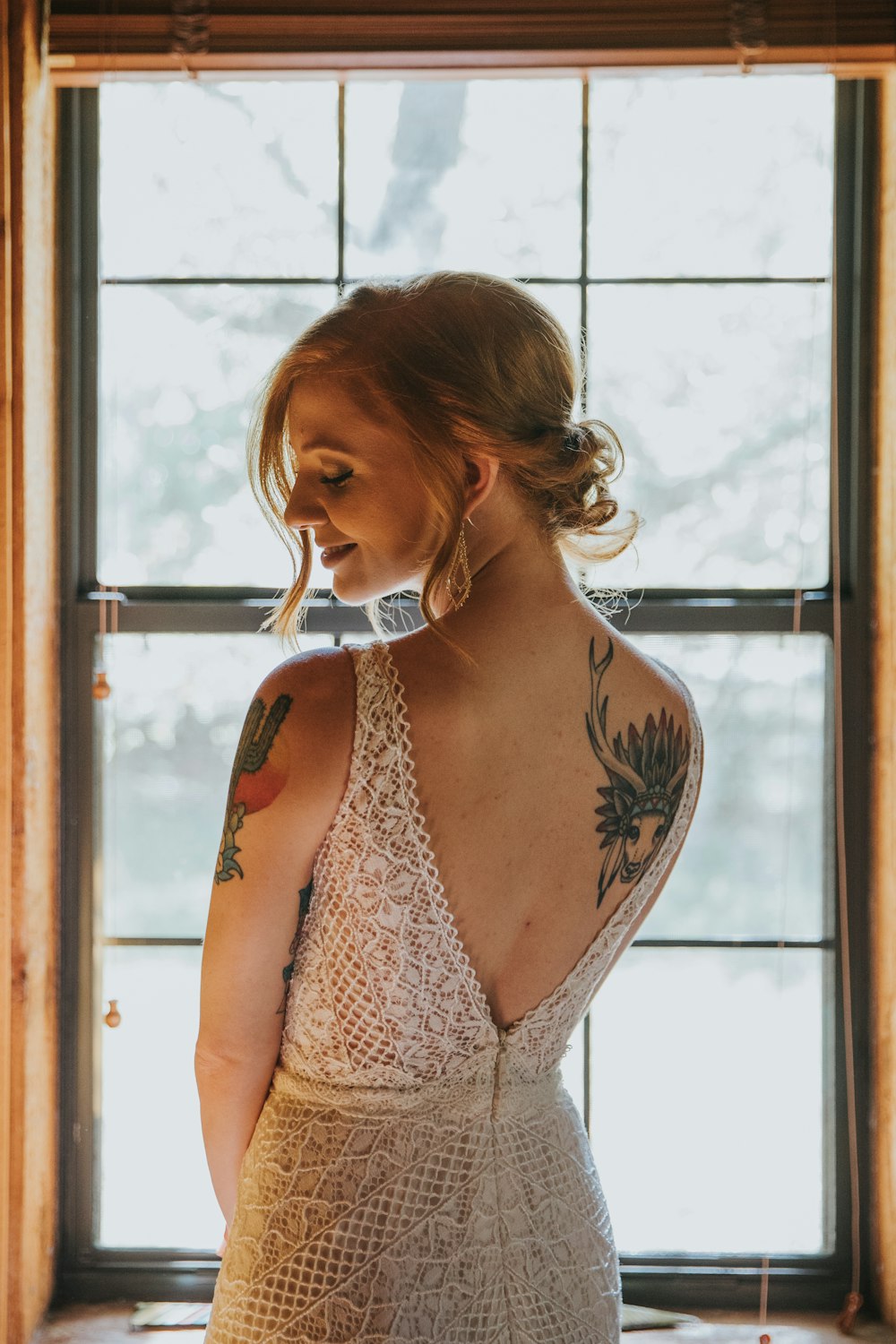 woman standing in front of glass window