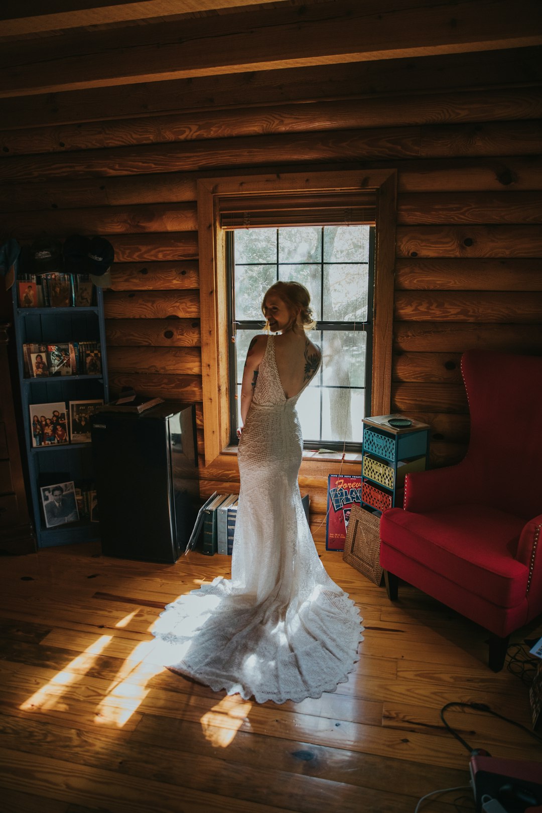 woman wearing white gown standing inside the house
