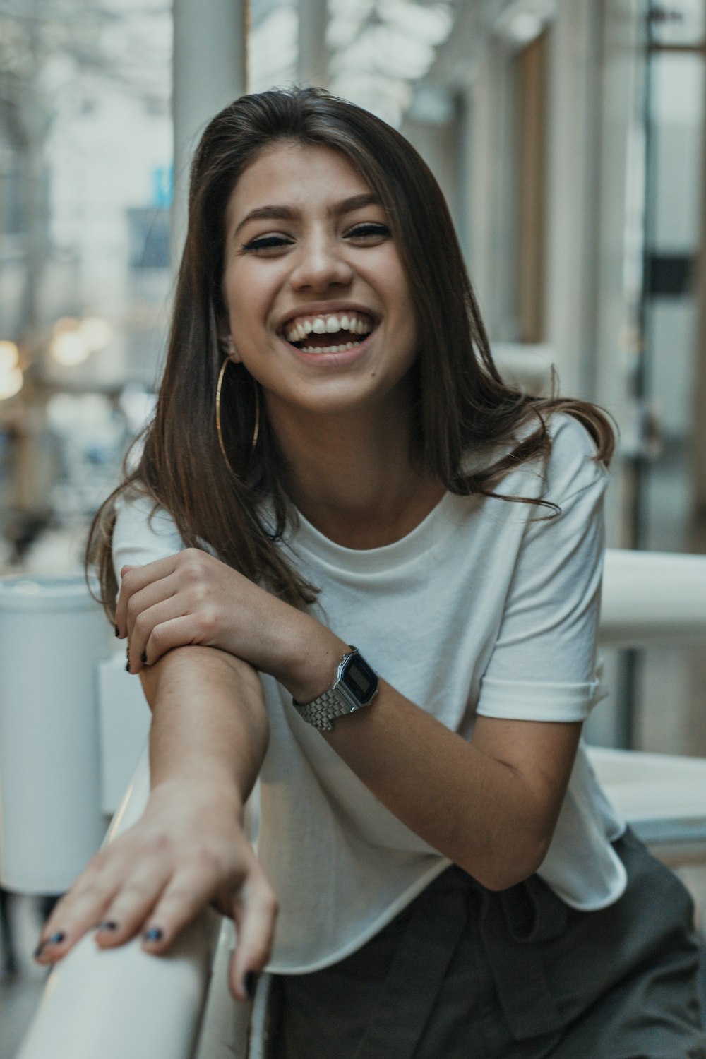 smiling girl wearing white crew-neck t-shirt