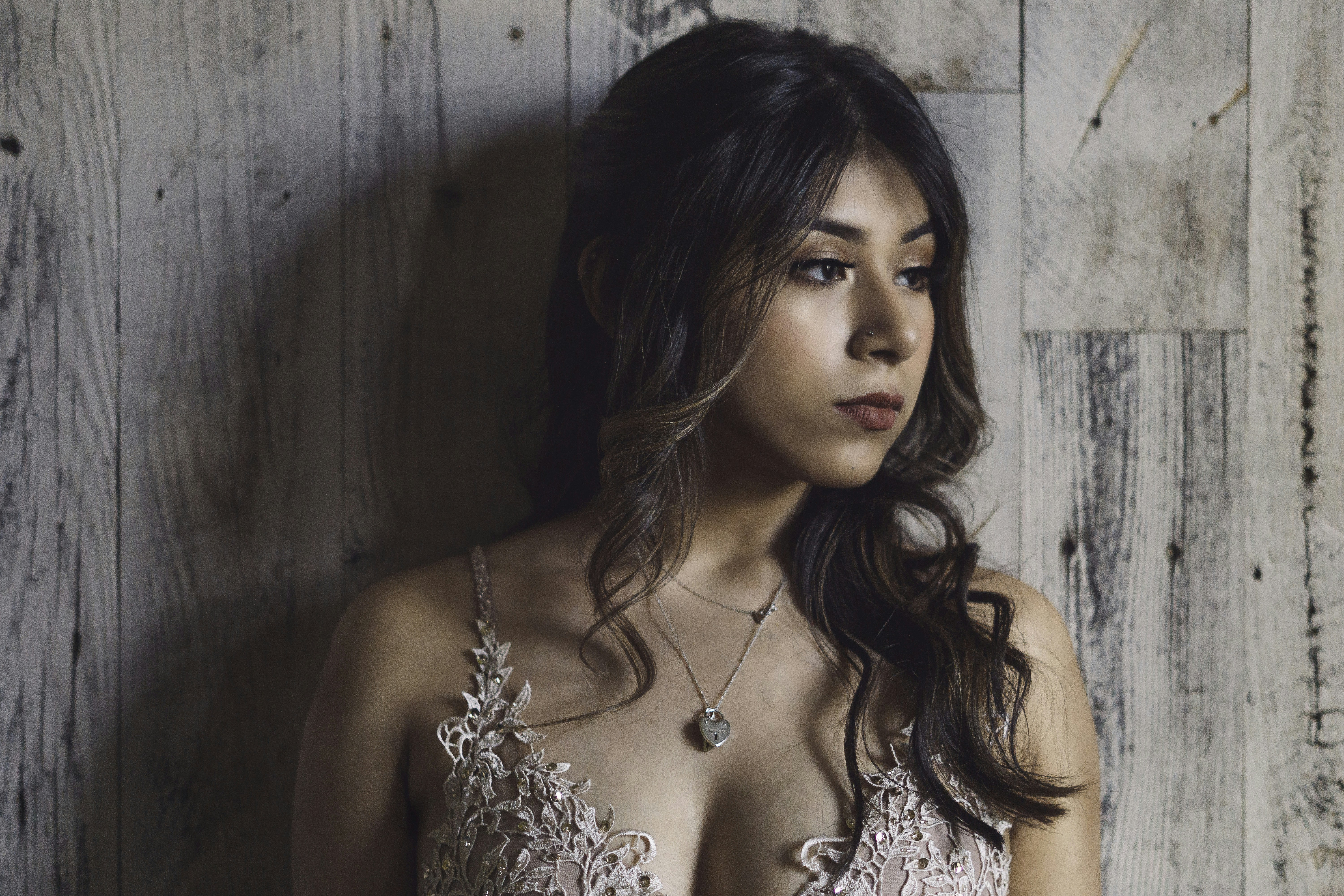 woman wearing brown cami top prom teams background