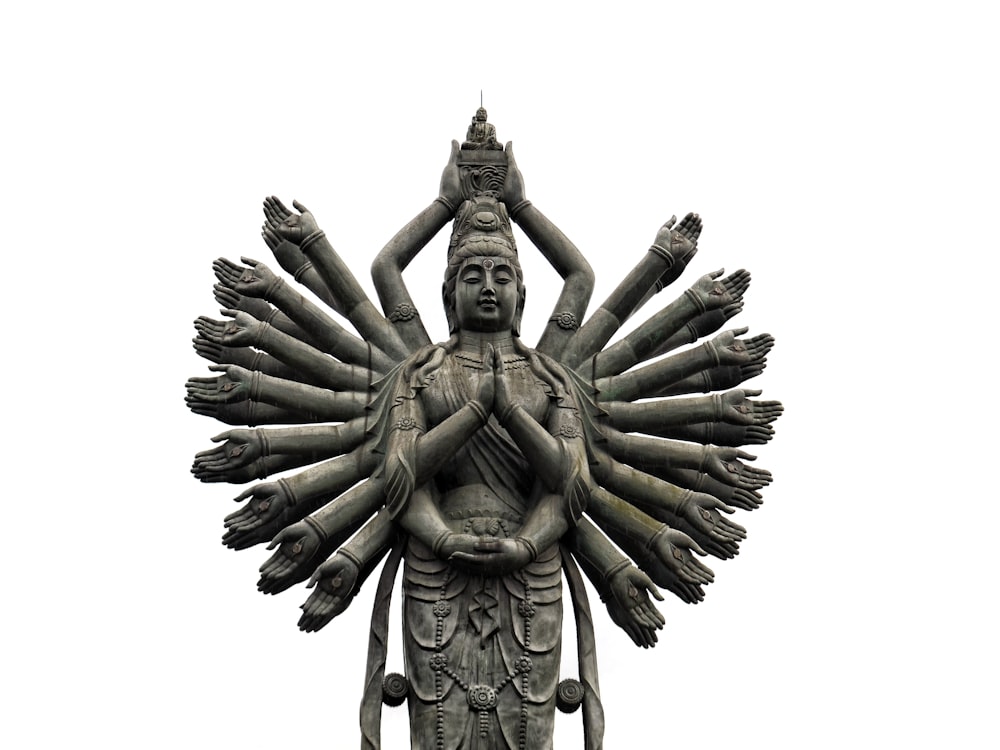 deity statue in grayscale photography