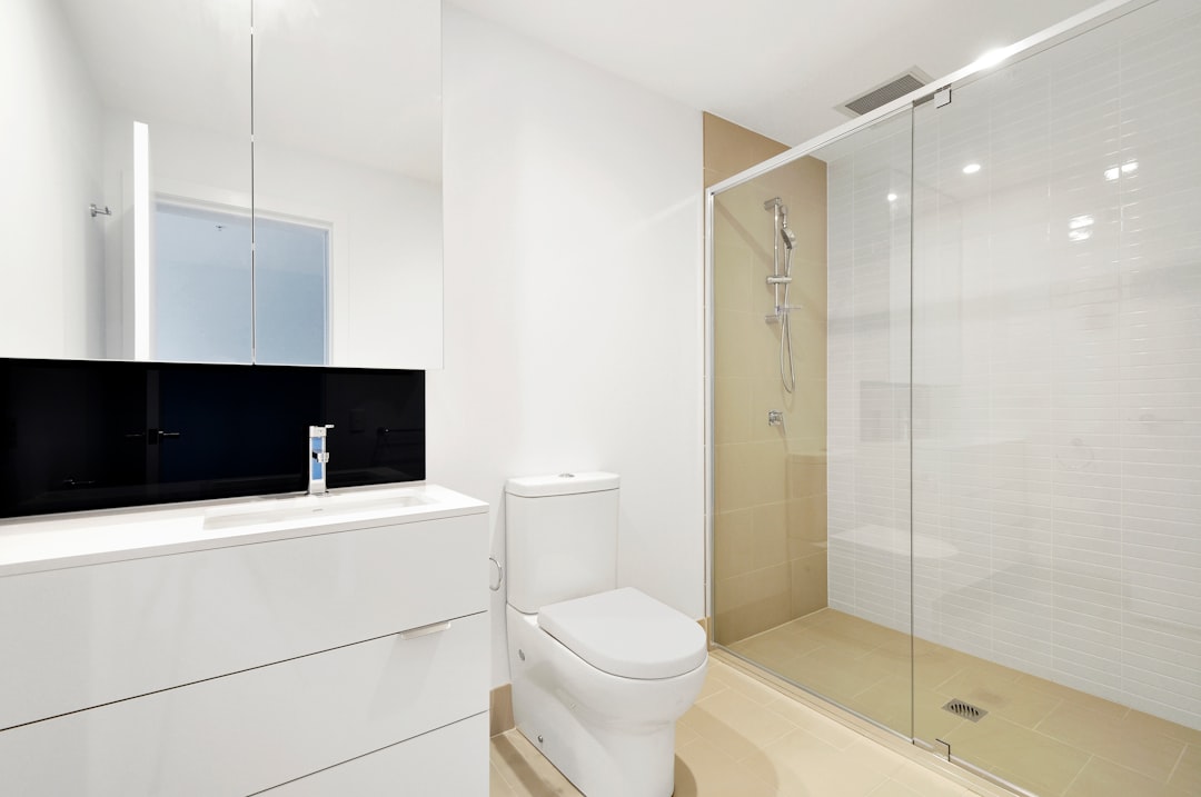 white, sleek, modern bathroom.  SINK THE BISMARCK!!!