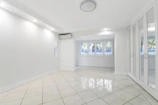 Clean tiled floor and minimalistic decor in a non-AC room.