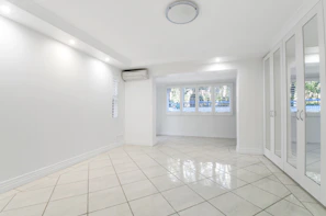 Clean tiled floor and minimalistic decor in a non-AC room.