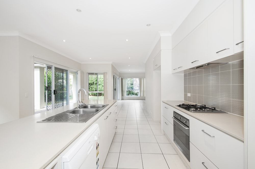 white wooden kitchen cupboards