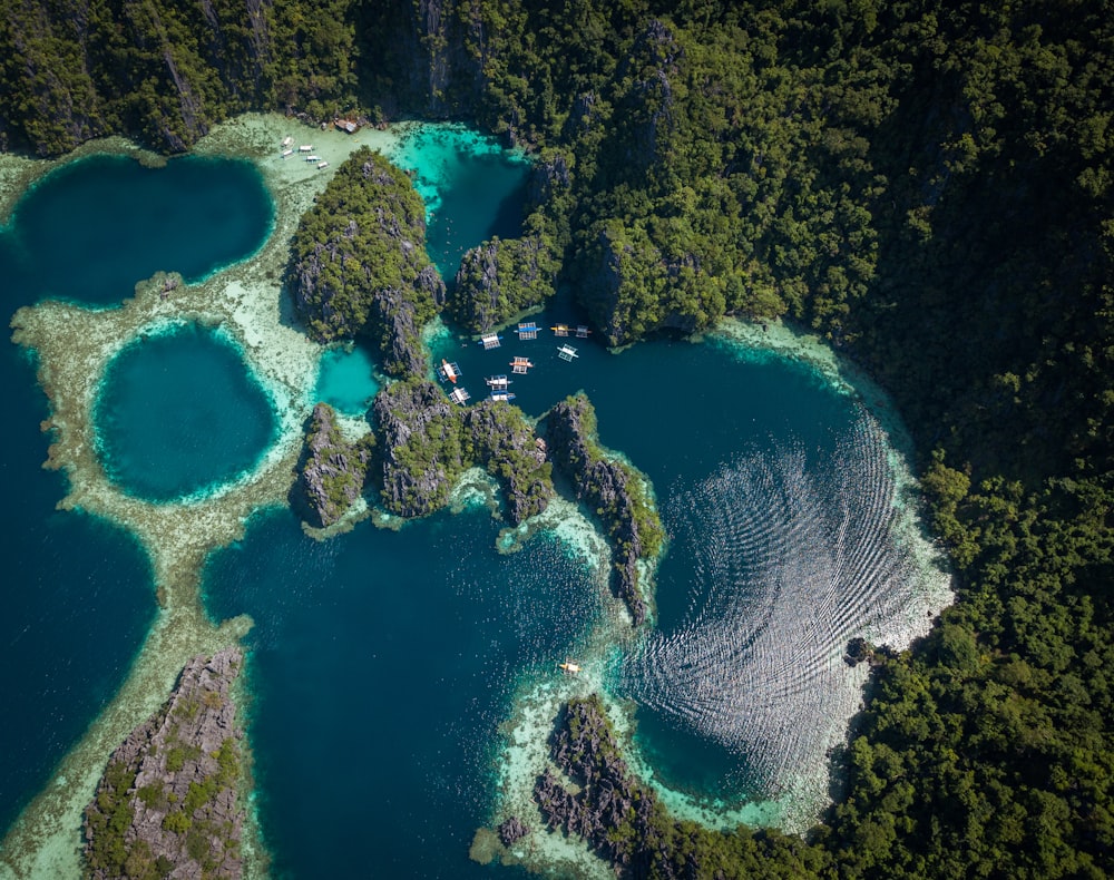 aerial photography of body of water near hill