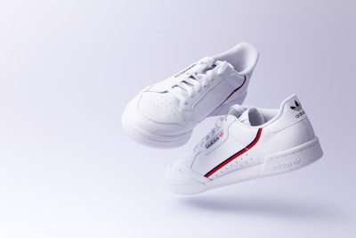 white adidas low-top sneakers sneaker teams background