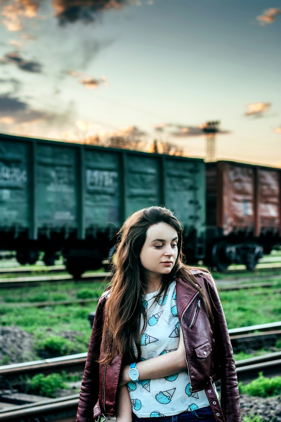 woman standing near train on selective focus photography
