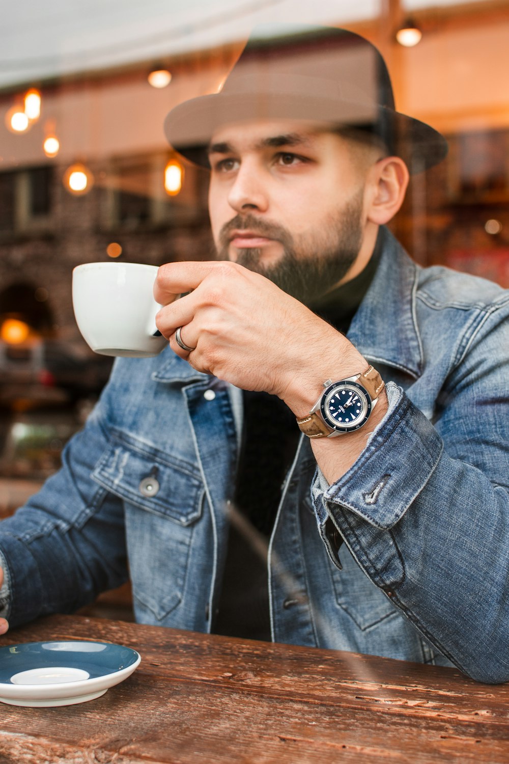 man drinking coffee in room