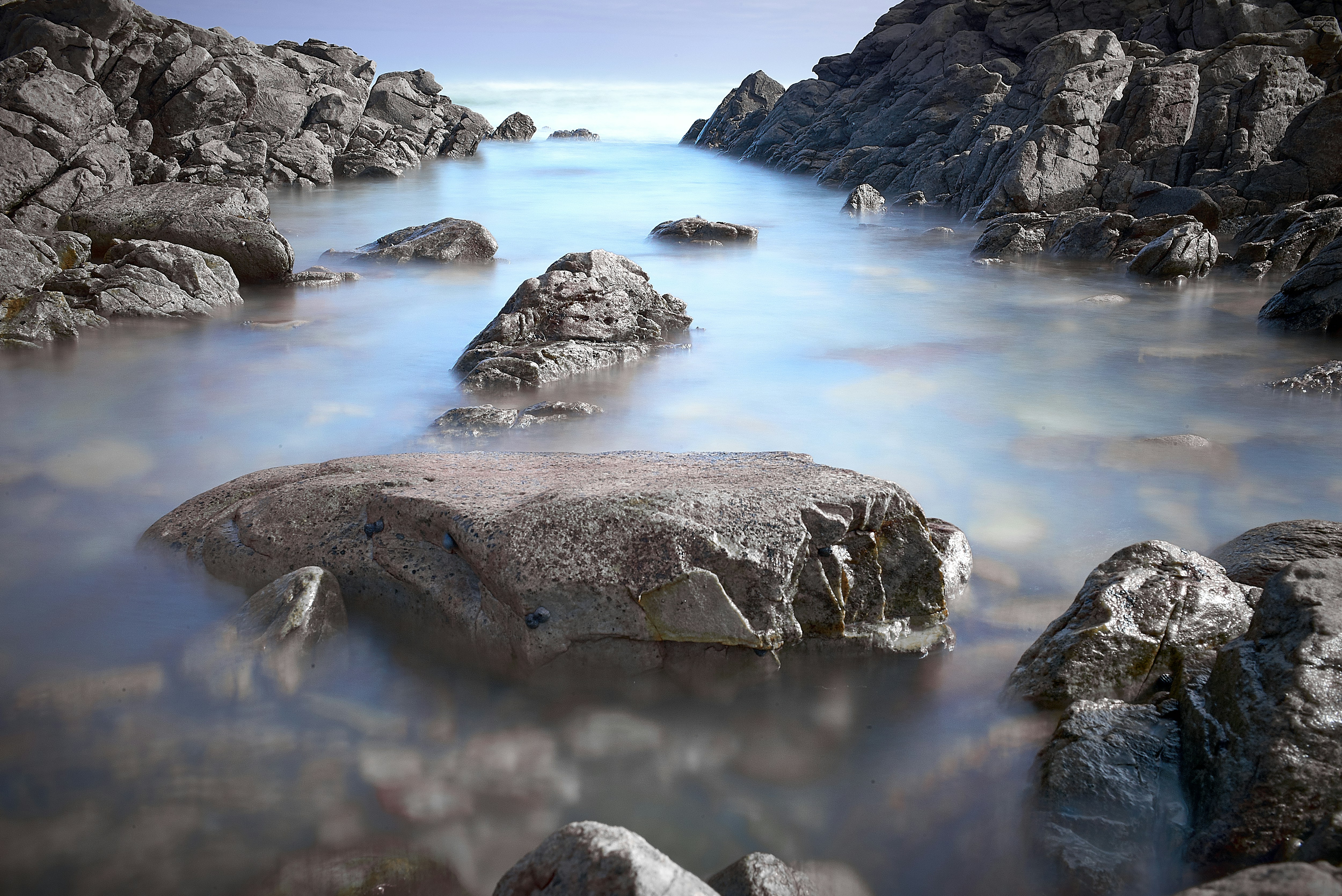 brown stone on body of water