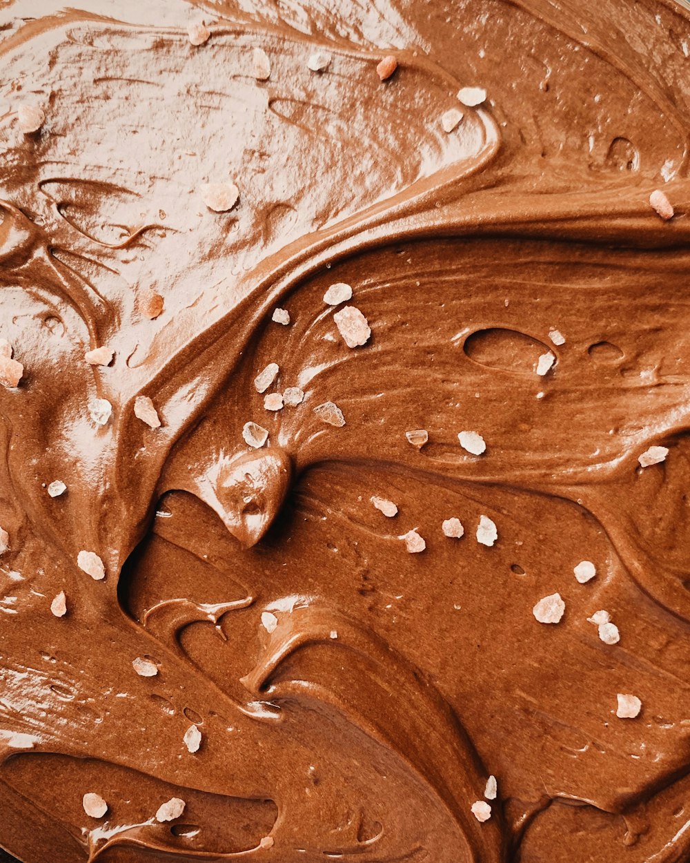 a close up of a chocolate frosted cake