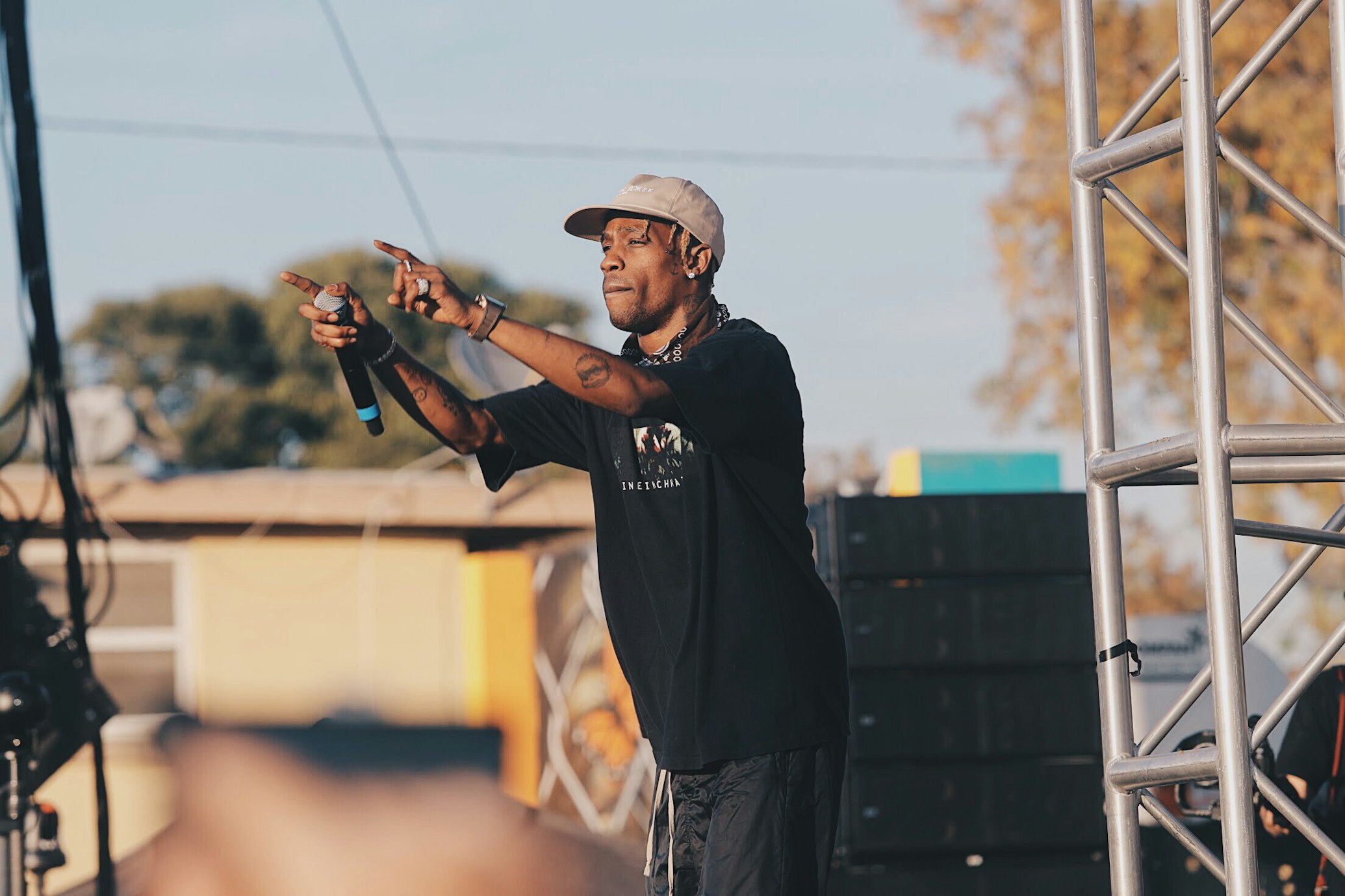 Travis Scott performing at a concert (Joel Muniz via Unsplash)