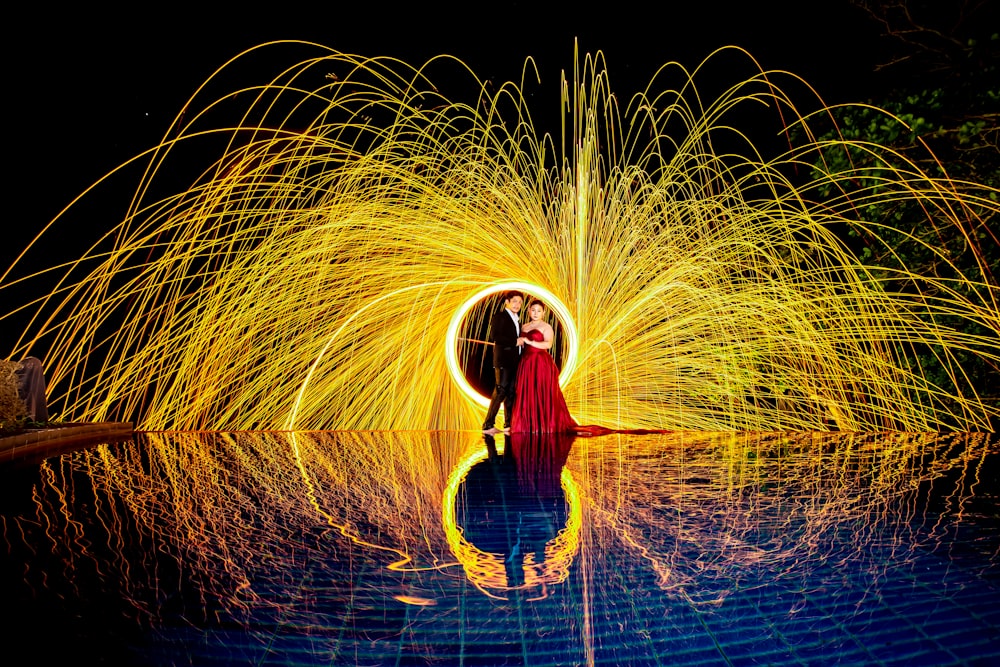 man and woman near steel wool photography