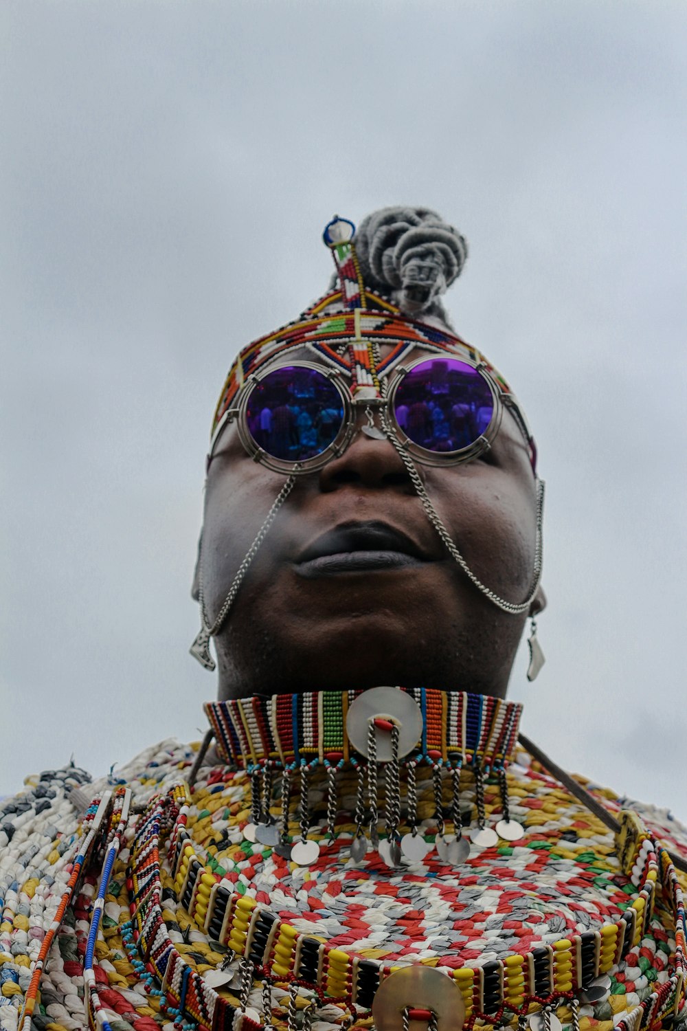 woman wearing grey framed purple sunglasses